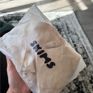 SKIMS SHEER SEAMLESS STRAPLESS SHORTIE BODYSUIT | SAND